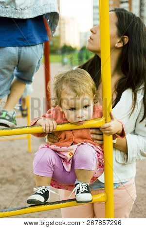 Little Girl With Mother Outside Walking At Playgarden, Lifestyle