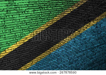 Tanzania Flag  Is Depicted On The Screen With The Program Code. The Concept Of Modern Technology And