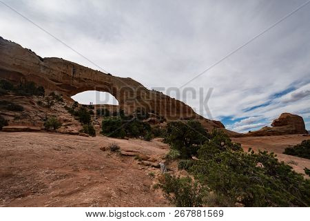 Wilson Arch, Located In Dry Valley Utah, Is An Entrada Standstone Rock Formation In The Desert