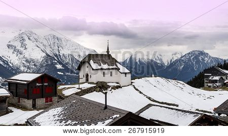 Bettmeralp, Switzerland - May 2017: Chapel In The Village At Sunset