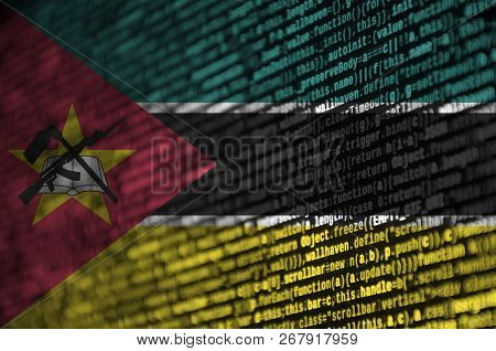 Mozambique Flag  Is Depicted On The Screen With The Program Code. The Concept Of Modern Technology A