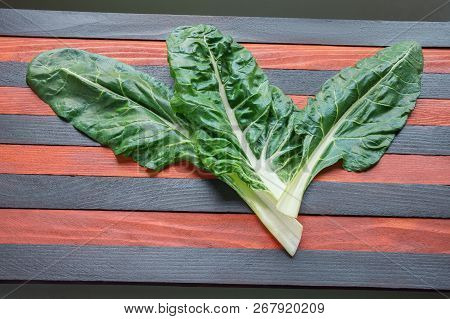 Blitva ( Chard Leaves ) - Popular Leafy Vegetables In Balkan Cuisine. Striped Rustic Background