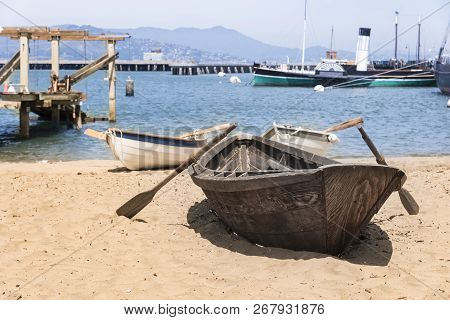 Landscape Of A Wooden Boat Harbored On The Beach