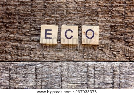 Inscription Eco Letters Word On Old Rustic Wooden Backdrop. Eco Village Abstract Environmental Backg