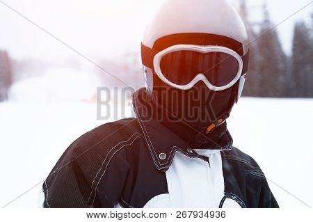 Portrait Of Teenager Skier On Snowy Mountain.