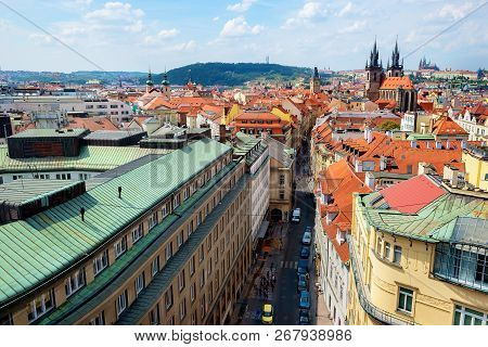 Tynsky And St Vitus Cathedral Among The Red Roofs Of Prague. View From Above