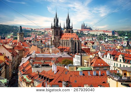 Tynsky And St Vitus Cathedral Among The Red Roofs Of Prague. View From Above