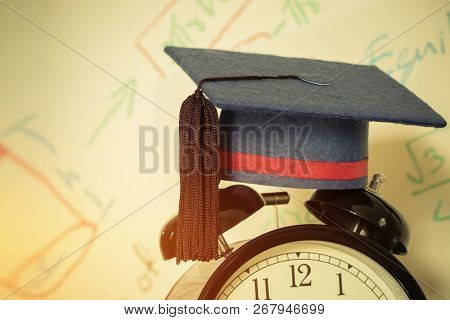 Graduation Cap On Top Retro Alarm Clock With Math Formula Equation Graph On Screen Classroom. Ideas 