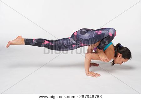 Full Length Woman Practicing Yoga Ekapada Yogadandasana Pose