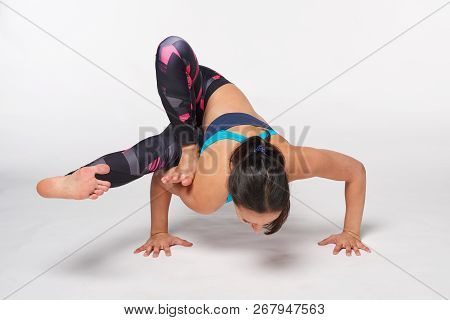 Full Length Woman Practicing Yoga Ekapada Yogadandasana Pose