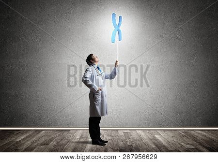 Conceptual Image Of Successful And Young Doctor In White Uniform Interracting With Dna Structure Whi