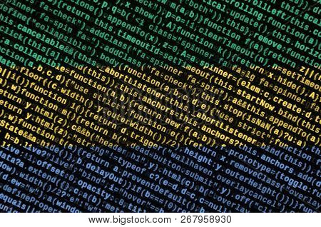 Gabon Flag  Is Depicted On The Screen With The Program Code. The Concept Of Modern Technology And Si
