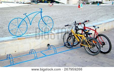 Santiago De La Ribera, Murcia, Spain - July 31 2018: Bicycles Parked In A Bike Rack, Marked By A Mod