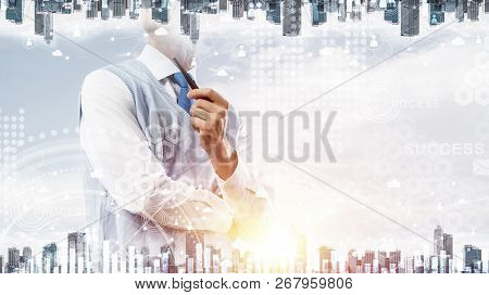 Double Exposure Of Confident And Young Businessman In Smart-casual Wear Smoking Pipe And Modern City