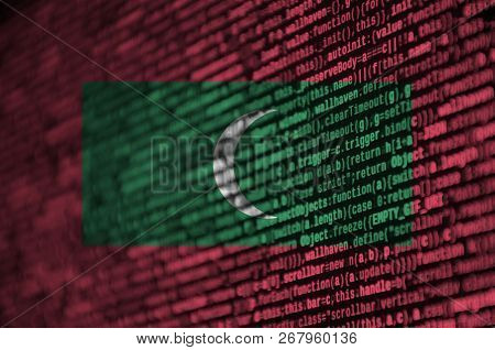 Maldives Flag  Is Depicted On The Screen With The Program Code. The Concept Of Modern Technology And