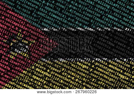 Mozambique Flag  Is Depicted On The Screen With The Program Code. The Concept Of Modern Technology A