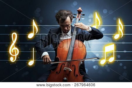 Young handsome cellist playing with music sheet background