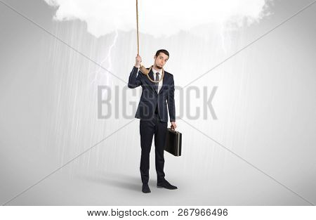 Young businessman trying to suicide with pointing hands concept