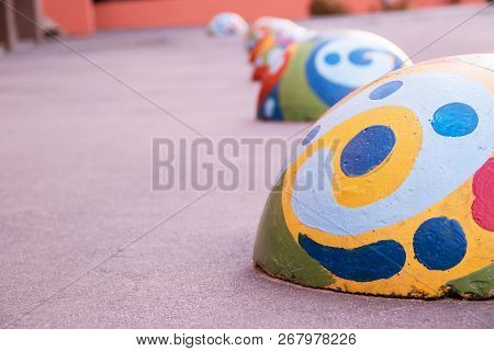 Multicolored Round Spheric Concrete Barriers Protect From The Entry Of Cars Onto The Sidewalk