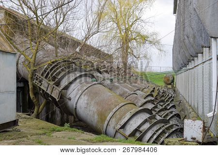 Outlet Pipes Of A Water Pumping Station. Pipes Of Large Diameter.