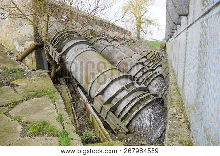 Outlet Pipes Of A Water Pumping Station. Pipes Of Large Diameter.