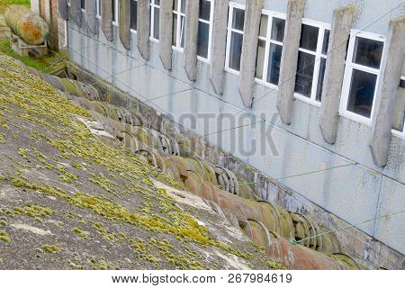Outlet Pipes Of A Water Pumping Station. Pipes Of Large Diameter. Wall, Building