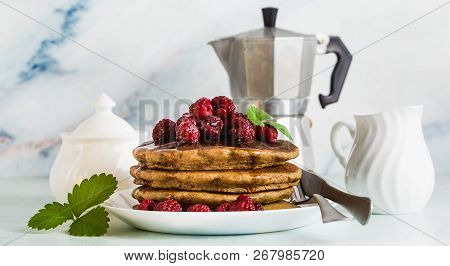 Banner Of Gluten-free Green Buckwheat Pancakes With Fresh Berries And Maple Syrup. Delicious Vegan B
