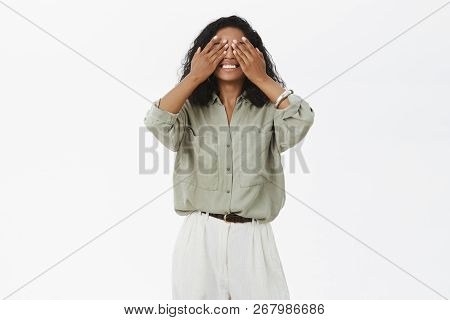 Can I Peek. Portrait Of Charming Kind And Gentle Dark-skinned Young Mom In Blouse And Pants Playing 