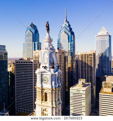 Statue Of Ben Franklin Looks Over The City Streets Of Philadelphia Pa