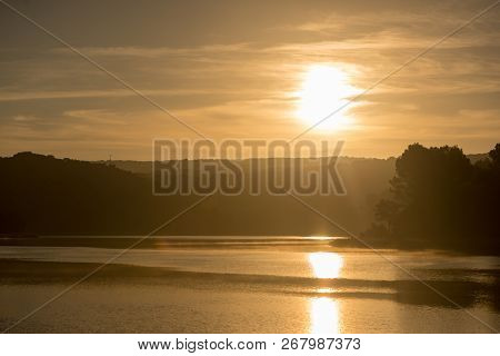 Sunset In The Ruidera Lagoons With The Golden Sky