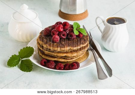 Gluten-free Green Buckwheat Pancakes With Fresh Berries And Maple Syrup. Delicious Vegan Breakfast W