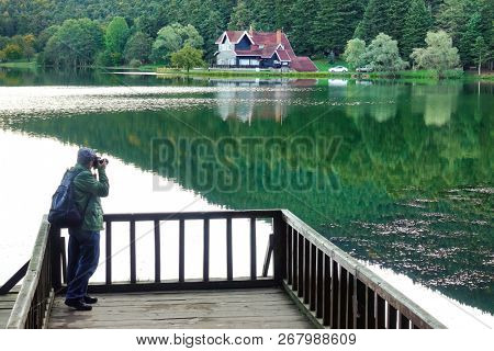A photographer takes photos in Golcuk National Park, Bolu - Turkey