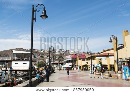 Ensenada, Mexico - October 22, 2018:  Tourists Stroll By The Shops And Restaurants On The Waterfront