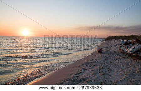 Sunset Time, Sun Near Horrizon, Kayak On The Beach