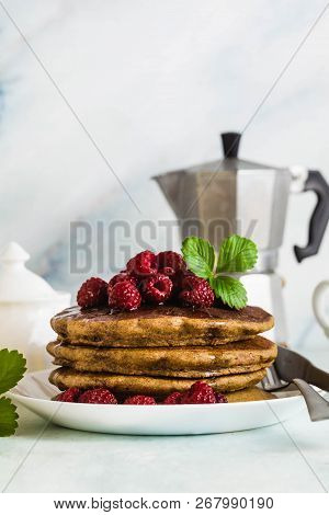 Gluten-free Green Buckwheat Pancakes With Fresh Berries And Maple Syrup. Delicious Vegan Breakfast W