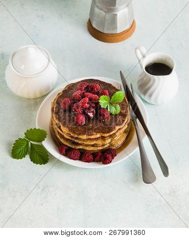 Gluten-free Green Buckwheat Pancakes With Fresh Berries And Maple Syrup. Delicious Vegan Breakfast W