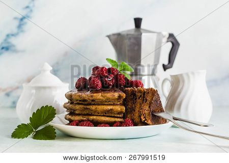 Gluten-free Green Buckwheat Pancakes With Fresh Berries And Maple Syrup. Delicious Vegan Breakfast W