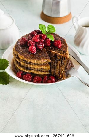 Gluten-free Green Buckwheat Pancakes With Fresh Berries And Maple Syrup. Delicious Vegan Breakfast W