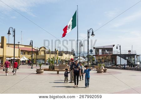 Ensenada, Mexico - October 22, 2018:  People Stroll Past Shops And Restaurants On The Boardwalk At E