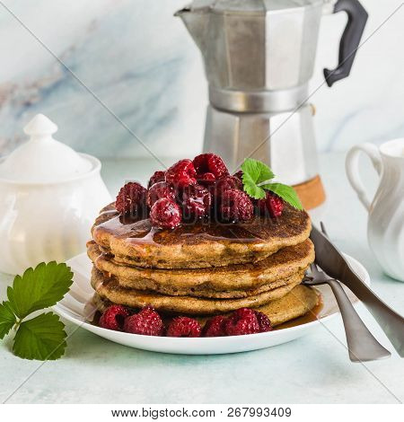 Gluten-free Green Buckwheat Pancakes With Fresh Berries And Maple Syrup. Delicious Vegan Breakfast W