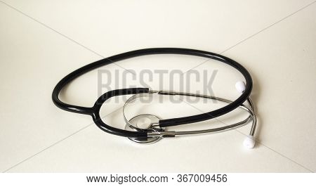 On A White Background With A Stethoscope. Medical Concept.