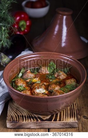 Moroccan Tagine Of Lamb With Kefta Meatballs In Tomato Sauce