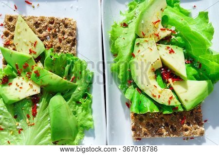 Risp Sandwich With Avocado. Snack Bread And Fiber Food. Wheat Crisp Bread. Flat Lay