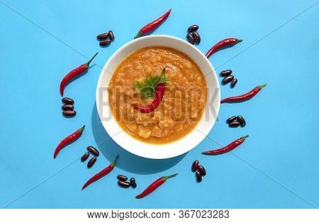 Famous Traditional Arabic Cuisine - Peeled Fava Beans With Chili In White Bowl On Blue Background. T
