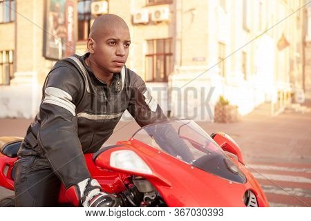 African Man On A Sport Motorbike In The City
