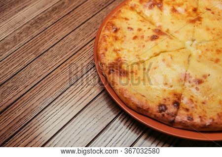 Top View On Tasty Traditional Megrelian Khachapuri - Pie With Melted Salt Cheese Suluguni And Egg Yo