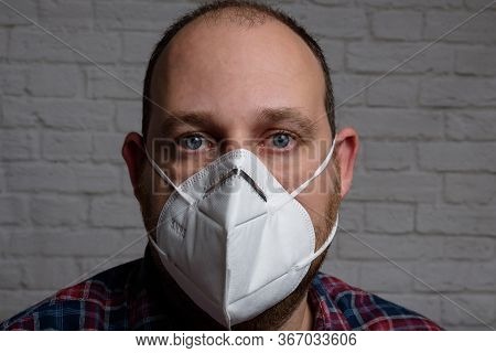 Young Man Wearing Kn-95 Protection Medical Mask. Prevention Of The Spread Of Virus And Epidemic, Pro