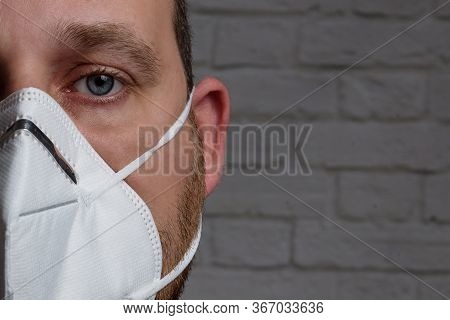 Young Man Wearing Kn-95 Protection Medical Mask. Prevention Of The Spread Of Virus And Epidemic, Pro