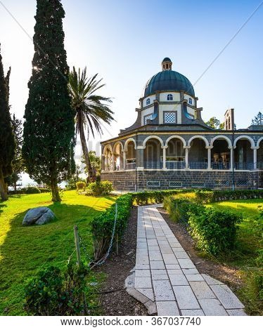 The Mount Bliss on the Sea of Galilee. Israel. Catholic Church of the Beatitudes of the Franciscan monastery. Blooming huge park around the monastery. The concept of religious pilgrimage 
