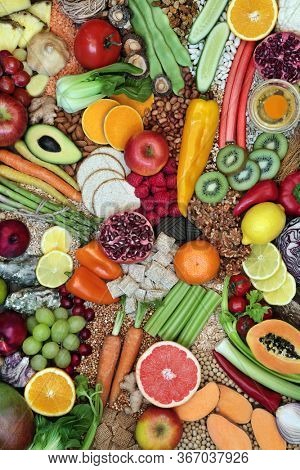 Large collection of immune boosting healthy food for fitness & energy with foods high in antioxidants, anthocyanins, vitamins, minerals, protein, omega 3, smart carbs, lycopene & fibre. Flat lay.